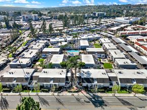 Fullerton apartment for rent - A large industrial area with multiple buildings and a swimming pool in the center.