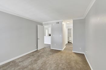 A room with carpeted floor and white walls.