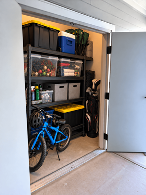 Lakeland apartment for rent - Exterior storage closet with shelving, bike and golf bag at Gibson Oaks, Lakeland, FL