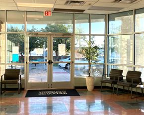El Paso apartment for rent - A glass door with an exit sign above it.