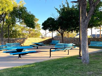 El Paso apartment for rent - A park with blue benches and trees.