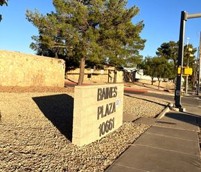 El Paso apartment for rent - A stone sign that says Baines Plaza stands on a gravel area.