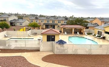 El Paso townhouse for rent - A backyard with a pool and a patio.