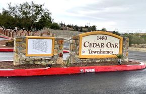 El Paso townhouse for rent - A sign for Cedar Oak Townhomes with a "No Parking" sign in front of it.