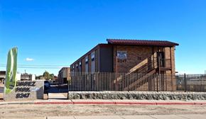 El Paso apartment for rent - A small building with a sign that reads "MAREZ PARK" is surrounded by a black fence.