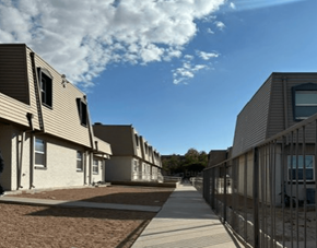 El Paso apartment for rent - A row of modern houses with a sidewalk in front.