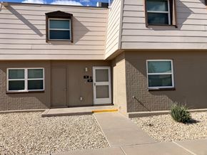 El Paso apartment for rent - A house with a brown door and windows.