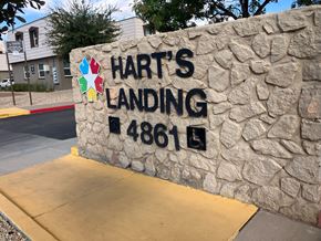 El Paso apartment for rent - A stone wall with a sign that says Hart's Landing 4861.