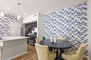 El Paso apartment for rent - a dining room with a table and chairs and a kitchen