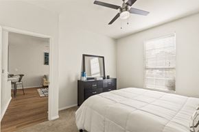 El Paso apartment for rent - a bedroom with a large bed and a ceiling fan