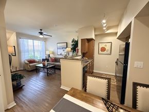 El Paso apartment for rent - A living room with a kitchen area in the background.