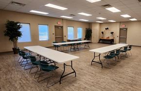 El Paso apartment for rent - A room with tables and chairs and a tree.