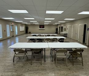 El Paso apartment for rent - A large room with tables and chairs is empty.