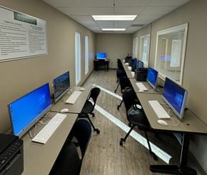 El Paso apartment for rent - A computer lab with multiple monitors and chairs.