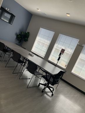El Paso apartment for rent - A conference room with a long table and chairs.