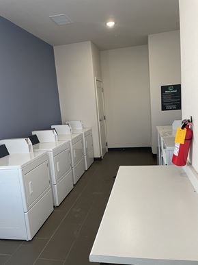 El Paso apartment for rent - A row of washing machines in a laundromat.