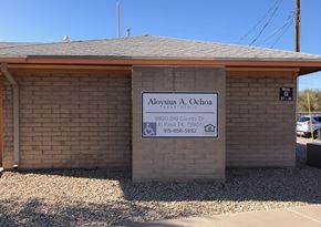 El Paso apartment for rent - A sign for Aloysius A. Ochoa is displayed in front of a building.