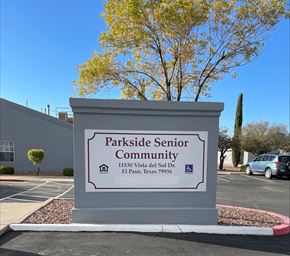 El Paso apartment for rent - A sign for Parkside Senior Community stands in front of a tree.