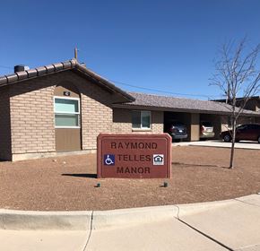El Paso apartment for rent - A sign in front of a building that says Raymond Telles Manor.