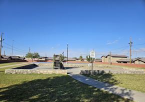 El Paso apartment for rent - A sign is on a pole in the middle of a grassy area.