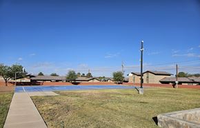 El Paso apartment for rent - A clear blue sky over a residential area with houses and a utility pole.