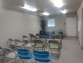 El Paso apartment for rent - A room with blue chairs and a table with numbers on them.