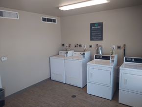 El Paso apartment for rent - A laundromat with washers and dryers in it.