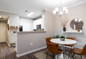El Paso apartment for rent - A dining room with a white table and brown chairs.
