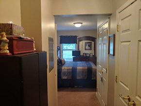 Louisville apartment for rent - a bedroom with a bed and a closet