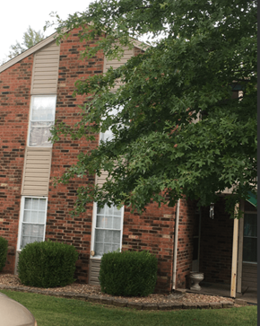 Greenville apartment for rent - a brick house with a tree in front of it