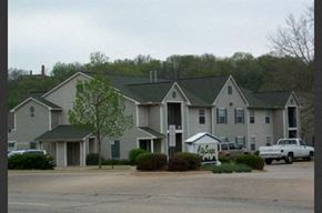 Peoria apartment for rent - a large apartment building with a sign in front of it