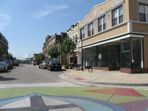 St. Louis apartment for rent - A street with a crosswalk and a building on the right.
