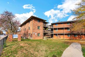 Louisville apartment for rent - a brick apartment building with a sidewalk in front of it