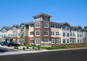 St. Louis apartment for rent - A large apartment complex with a parking lot in front.