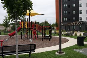 Minneapolis apartment for rent - a playground in a park next to a building
