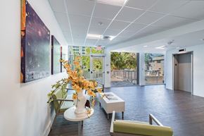 St. Petersburg apartment for rent - a lobby with a vase of flowers on a table