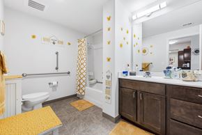 St. Louis apartment for rent - a bathroom with a toilet and a sink and a mirror