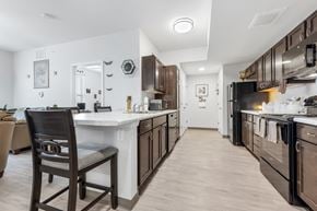 St. Louis apartment for rent - a kitchen with a large island and a stove and a refrigerator