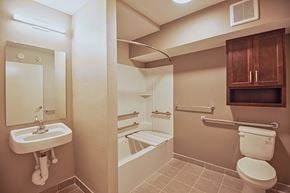 Jacksonville apartment for rent - A bathroom with a toilet, sink, and bathtub.