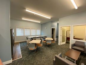 Rock Island apartment for rent - A conference room with a long table and chairs.