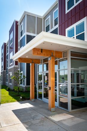 St. Louis apartment for rent - a view of the front of a building with glass doors and a porch