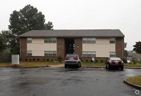 Hopkinsville apartment for rent - an apartment building with cars parked in a parking lot