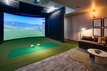 Golf, hockey & multisport simulator room with plush lounge area