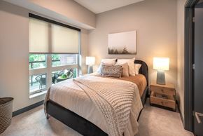 St Louis Park apartment for rent - a bedroom with a bed and a large window