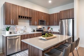 Edina apartment for rent - a kitchen with stainless steel appliances and a white counter top