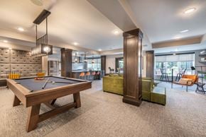 Lakeville apartment for rent - a spacious game room with a pool table and a bar
