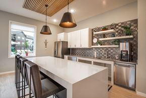 Maple Grove apartment for rent - a kitchen with a large white counter top and stainless steel appliances