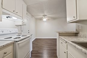 Fremont apartment for rent - A kitchen with white appliances and wooden floors.