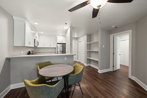 San Leandro apartment for rent - a dining area with a table and chairs and a kitchen in the background