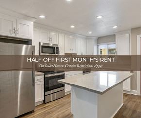 Fremont apartment for rent - a kitchen with white cabinets and stainless steel appliances